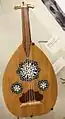 Egyptian oud with common triple soundhole shams (rose) design.