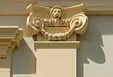 Neo-Renaissance pilaster capital in Pörtschach am Wörthersee (Austria), decorated with a festoon and a lion head above