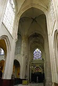 The south transept, with 16th century rose window