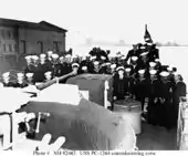 Enlisted complement on the fantail, at the time of her commissioning ceremonies.