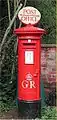 PB27/1 pillar of George V, fitted with a Post Office Direction Sign (POD) at the Colne Valley Postal History Museum, Essex