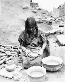 Hopi Woman of Oraibi, Third Mesa, making coiled pottery