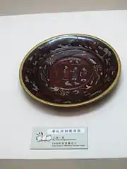 Painted lacquerware dish from the tomb of Zhu Ran (182–249&nbsp;AD) in Anhui province, showing figures wearing Hanfu, Eastern Wu period