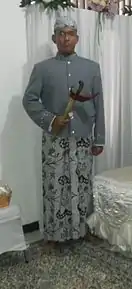 The Javanese traditional attire for men is always worn with the Blangkon and accompanied by a Kris