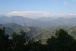 Mahabharat Range near Tansen. The High Himalayas are barely visible in the snow and cloud.