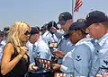 Image 10Playmate of the Year and People for the Ethical Treatment of Animals spokesperson Pamela Anderson, signing DVDs at the USS Halsey