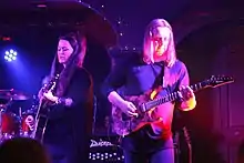 Members of Panic Room perform in July, 2017