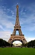 The Eiffel Tower in Paris, France, a popular tourist attraction. Almost 7 million visit the tower each year.[citation needed]