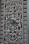 Renaissance Revival cast iron door window grill of a building on Rue du Bac from Paris