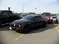 A Ford Mustang GT illegally occupying two parking spaces at Vaughan Mills mall, Ontario.