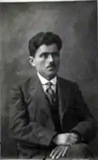 Photograph of a seated Pontic Greek man in a suit.