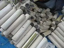 Paung din - glutinous rice, both purple and white varieties, cooked in bamboo tubes