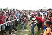 A tug of war by men commemorating independence day