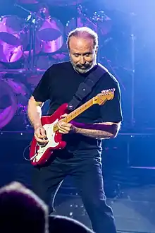 Stuermer performing with Phil Collins in 2017