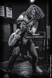 Phil X performing in 2013