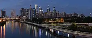 Philadelphia (in the background) and the Schuylkill River (on the left) as seen from South Street Bridge, July 2016