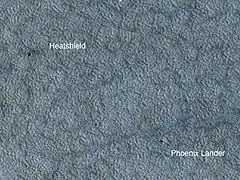 The Phoenix lander and its heatshield as seen by HiRISE