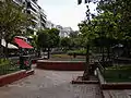 The historic Fokionos Negri Street, now pedestrianised with numerous cafés and a park along its length, runs through the middle of the district.