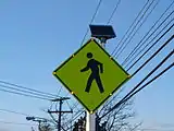 Crosswalk alert with solar-powered lit outline.
