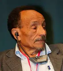 Rabhi, listening with earphones