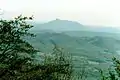 Pilot Mountain's distinctive "saddle" shape as seen from the north. Pilot can also be seen from mile marker 189.1 of the Blue Ridge Parkway in Virginia.