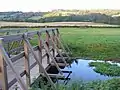 Pipp Brook footbridge in fields to the immediate north of the village centre