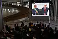 Screen inside the Planalto Palace showing President Luiz Inácio Lula da Silva delivering his public address at the Parlatorium