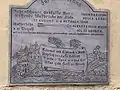 Memorial plaque of the 1868 flood written in German and Italian