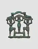 Plaque with a nude female between two bearded males wearing kilts; circa 2000-1600 BC; bronze; 9.7 x 9.7&nbsp;cm; Metropolitan Museum of Art