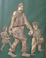 A rosette by Simon Shiroka of an old man wearing the Albanian hat “Plisi”.