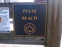 "Plum Beach" sign in Plumb Beach