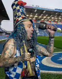 Westwood playing his Bugle and Hand Bell