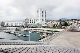 The urbanized coastal limit of Ponta Delgada at São Sebastião, including the commercial mall and business quarter, as seen from the Portas do Mar
