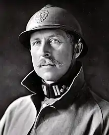 A man wearing a military uniform with helmet