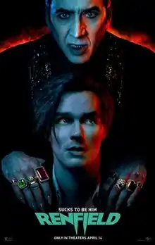 Two vampires stand in the middle of the poster, one above the other. The one above, Dracula, bares his teeth and grabs onto the shoulders of the other vampire, Renfield, who concerningly looks up.