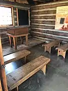 Inside the replica of Prescott's first community schoolhouse.