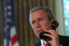 President W. Bush speaks on the phone to New York's Governor and Mayor respectively, George Pataki and Rudy Giuliani, two days after the September 11 attacks.(Draper, 2001)