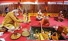 Narendra Modi performing Bhoomi Pujan. Also visible are Mohan Bhagwat and Anandiben Patel.