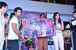 A picture of four people looking towards the camera