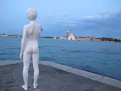 Public statue by Charles Ray at tip of Punta della Dogana.