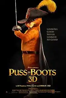 Theatrical poster showing Puss in Boots, an orange cat wearing a hat with a feather on, boots and a cape, in the black background. Tagline in gold to the side reads "Looking Good Never Looked So Good", with "Puss in Boots 3D" in large gold lettering underneath.