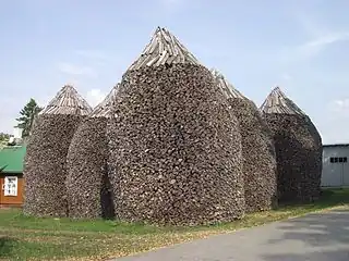 Firewood stacks at Pühtitsa Convent in Estonia are about 6 meters high.