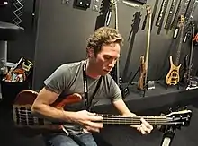 A man playing bass guitar