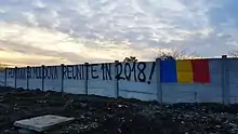 Graffiti in Bucharest. "Romania and Moldova reunited in 2018!".