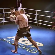 Image 28Riyadh Alazzawi fighting for his seventh world heavyweight kickboxing title in his hometown of Baghdad, Iraq. (from Sport in Iraq)