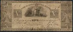 Five dollar bill. The illustration includes female figure with a rake and grain; and a seated Justice with sword and scales. The inscription reads Inscription: "THE HARRISBURG BANK Promises to pay FIVE dollars on demand to ___ or bearer."
