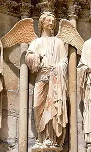 The High Gothic - Smiling Angel, north portal of west facade of Reims Cathedral, by the St. Joseph Master. (1240)