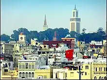 Religious pluralism in Tangier: towers of the Immaculate Conception Church, of the Tangier Cathedral, and of the Mohammed V Mosque