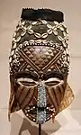 Ngaad-A-Mwash mask; by the Kuba people; late 19th-early 20th centuries; wood, shells, glass beads, raffia and pigment; height: 82&nbsp;cm; Detroit Institute of Arts (Detroit, Michigan, USA)