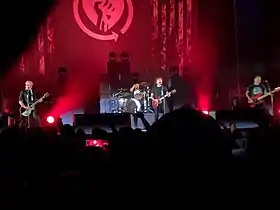 Rise Against performing in Philadelphia in 2021. From left to right: Zach Blair, Brandon Barnes, Tim McIlrath and Joe Principe.